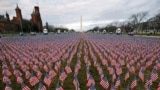 Thousands of U.S. flags are seen at the National Mall, as part of a memorial paying tribute to the U.S. citizens who have died from the COVID-19, near the Capitol ahead of President-elect Joe Biden's inauguration, in Washington, D.C.