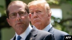 Health and Human Services Secretary Alex Azar delivers remarks on reducing drug costs as President Donald Trump looks on in the Rose Garden at the White House in Washington, on May 11, 2018. 