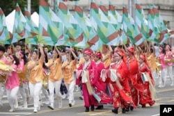 Dancers perform during National Day celebrations in front of the Presidential Building in Taipei, Taiwan, Oct. 10, 2024.