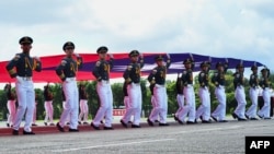 Students from the Republic of China Military Academy march with the Taiwanese flag during the academy's 100th anniversary ceremony in Kaohsiung, Taiwan, on June 16, 2024. China announced on June 21 new punishments for Taiwan independence separatists — including the death penalty.