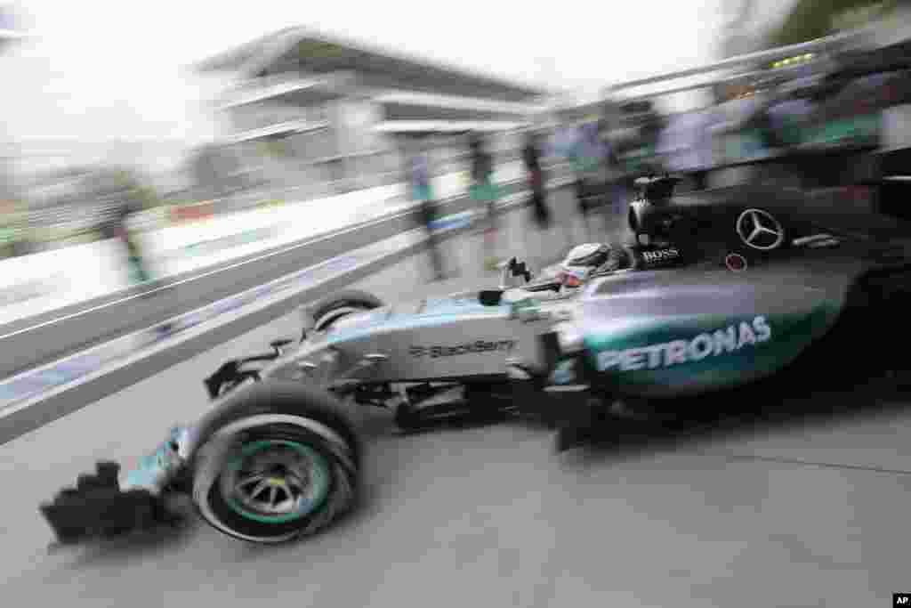 Mercedes driver Lewis Hamilton, of Britain, exits the pits during a free practice for the Formula One Brazilian Grand Prix at the Interlagos race track in Sao Paulo, Brazil. Hamilton, who won the championship at the U.S. Grand Prix last month, posted the fastest practice time Friday morning. The race is on Sunday, the penultimate round of the season.