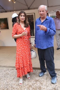 FILE - Peter Beard and his wife, Nejma, attend a benefit in Water Mill, New York, July 28, 2018.