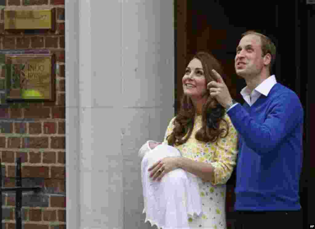 Britain's Prince William and Kate, Duchess of Cambridge and their newborn baby princess, pose for the media as they leave St. Mary's Hospital's exclusive Lindo Wing, London, Saturday, May 2, 2015. Kate, the Duchess of Cambridge, gave birth to a baby girl