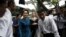 Myanmar pro-democracy leader Aung San Suu Kyi and UNHCR special envoy Angelina Jolie Pitt arrive at a hostel for female factory workers in the Hlaingtaryar Industrial Zone in Yangon, August 1, 2015. 