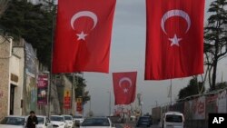  A main street decorated with Turkish flags near the Reina club four days after the New Year's day attack, in Istanbul, Wednesday, Jan. 4, 2017. 