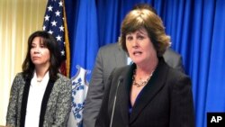 FILE - Special Agent in Charge Patricia Ferrick (R) speaks at a news conference in New Haven, Conn., Feb. 4, 2015, as the FBI fights allegations that Connecticut FBI agents retaliated against employees for whistleblowing.