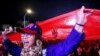 Supporters hoist a giant Taiwan national flag during a campaign rally of Kuomintang (KMT) ahead of Taiwan's presidential election, in Taipei, Taiwan, on Dec. 23, 2023.