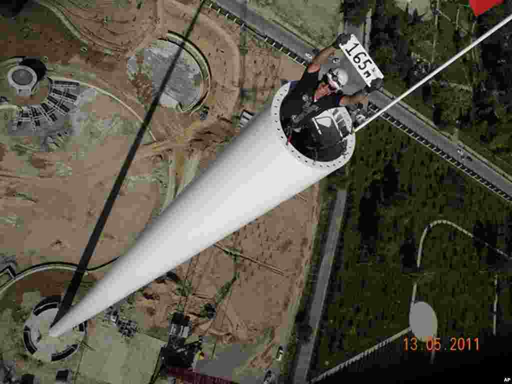 David Chambers inside the world's tallest flagpole as it is being built in Dushanbe, Tajikistan, May 13, 2011. Photo courtesy of David Chambers.