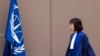 FILE - Judge Tomoko Akane walks before delivering a verdict at the International Criminal Court in The Hague, Netherlands, Nov. 20, 2024.