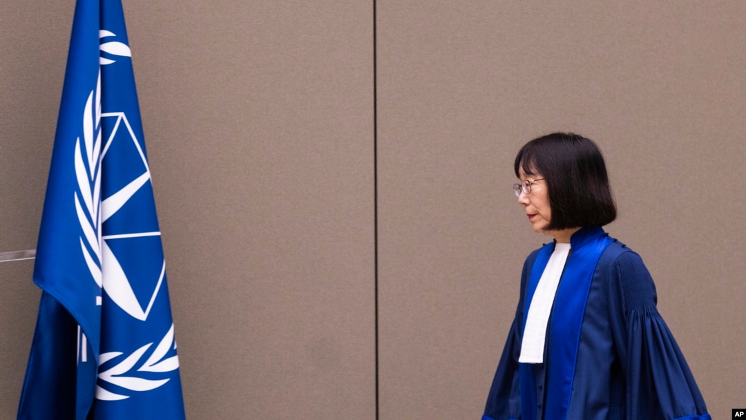 FILE - Judge Tomoko Akane walks before delivering a verdict at the International Criminal Court in The Hague, Netherlands, Nov. 20, 2024.
