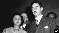 In this 1951 file photo, Ethel and Julius Rosenberg, center, are shown during their trial for espionage in New York. 