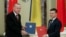 Ukrainian President Volodymyr Zelenskiy, right, and Turkey's President Recep Tayyip Erdogan pose for a photo during a signing ceremony in Kyiv, Ukraine, Feb. 3, 2020.