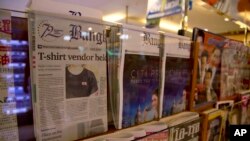 Thailand's Bangkok Post newspaper depicting a cover story on detention of a vender who sold black t-shirts, bearing a symbol allegedly linked to a movement promoting a federal republic, is displayed in a newspaper stall in Bangkok, Thailand, Tuesday, Sept. 11, 2018.