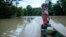 Bernardino Mosquera, a river guardian, maneuvers on water near Paimado, Colombia, Sept. 23, 2024.