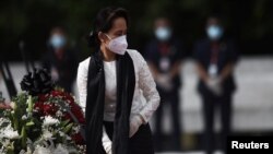 Myanmar State Counsellor and Foreign Minister Aung San Suu Kyi leaves after paying her respects to her late father during a ceremony to mark the 73rd anniversary of Martyrs' Day in Yangon, July 19, 2020.