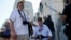 eff Morgan (L) and his father, World War II Marine veteran Eugene Morgan, both of Collierville, Tennessee, arrive to visit the World War II Memorial in Washington, Oct. 2, 2013.