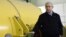 Israel's Prime Minister Benjamin Netanyahu stands next to a free-electron laser (FEL) during a visit to the Ariel University Center in the West Bank Jewish settlement of Ariel, January 8, 2013.