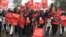 Protestors carrying placards march in the streets of Nairobi, Kenya, June 5, 2018, demanding the government halt a project to build a coal power plant in the city of Lamu. (M. Yusuf/VOA)