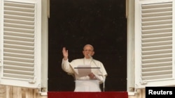 Pope Francis makes a blessing as he arrives for the Angelus prayer in Saint Peter's Square at the Vatican, April 15, 2018.