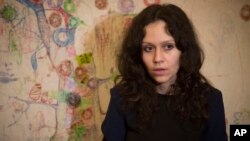 FILE - Lyudmila Savchuk speaks in an interview in her apartment in St. Petersburg, Russia, April 15, 2015. 