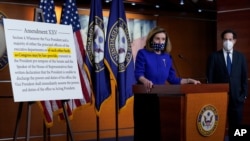 Speaker of the House Nancy Pelosi speaks during a news conference at the Capitol in Washington, Oct. 9, 2020, as Congressman Jamie Raskin looks on.