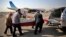 Iranian men load the coffin of a dead hajj pilgrim who was killed in a deadly stampede in Mina near Mecca in Saudi Arabia on September 24, into a car at Mehrabad airport in Tehran, Iran, Oct. 3, 2015.