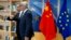 European Commission President Jean-Claude Juncker (R) speaks with China's Foreign Minister Wang Yi prior to a meeting at EU headquarters in Brussels, June 1, 2018, as the two sides deepen ties on trade and investment.