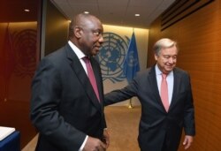 FILE - U.N. Secretary-General Antonio Guterres, right, greets South Africa's President Cyril Ramaphosa at the United Nations in New York, Sept. 25, 2018.