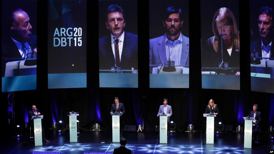 Presidential candidates Adolfo Rodriguez Saa, left, Sergio Massa, second left, Nicolas del Cano, third left, Margarita Stolbizer, second right, and Mauricio Macri attend the debate between presidential hopefuls in Buenos Aires, Argentina, Oct. 4, 2015.