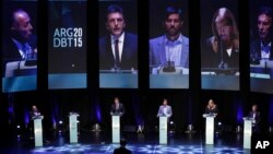 Presidential candidates Adolfo Rodriguez Saa, left, Sergio Massa, second left, Nicolas del Cano, third left, Margarita Stolbizer, second right, and Mauricio Macri attend the debate between presidential hopefuls in Buenos Aires, Argentina, Oct. 4, 2015.