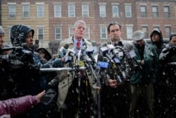 Jersey City's mayor Steven Fulop, right, and the Director of Public Safety James Shea talk to reporters across the street from a kosher supermarket in Jersey City, N.J., Dec. 11, 2019.