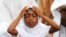 A girl prays during Eid el-Kebir at a mosque in Koumassi, in the Ivorian capital Abidjan. Muslims around the world celebrate Eid el-Kebir, also known as Eid al-Adha, by slaughtering sheep, goats, camels and cows to commemorate Prophet Abraham's willingness to sacrifice his son, Ismail, on God's command.