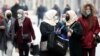 BOSNIA AND HERZEGOVINA -- PANDEMIC CORONAVIRUS BLACK FRIDAY -- Women wearing face masks walk in Sarajevo, in the midst of the COVID-19 coronavirus pandemic, in Sarajevo, Bosnia and Herzegovina, 24 November 2020. EPA-EFE/FEHIM DEMIR