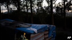 A migrant rests in a makeshift shelter in Las Raices camp in San Cristobal de la Laguna on the Canary Island of Tenerife, Spain, March 17, 2021. 