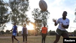 FILE - Members of the Zimbiru Rugby Academy Club, an all-female rugby team take part in a training session at Zimbiru primary school in Domboshava outside Harare, Zimbabwe, May 2, 2023.