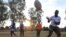 FILE - Members of the Zimbiru Rugby Academy Club, an all-female rugby team take part in a training session at Zimbiru primary school in Domboshava outside Harare, Zimbabwe, May 2, 2023.