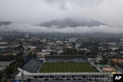 Storm clouds descend implicit    the Francisco Morazan stadium during rains brought connected  by Tropical Storm Sara successful  San Pedro Sula, Honduras, Nov. 15, 2024.