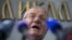 FILE - Serbian nationalist leader Vojislav Seselj speaks during a news conference inside his Serbian Radical Party headquarters in Belgrade, April 2, 2015.