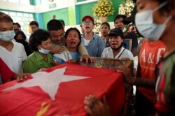 Relatives cry over the body of Min Khant Soe, who was shot and killed during a security force crack down on anti-coup protesters in Yangon, Myanmar, March 15, 2021.