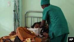 A person is treated, at a public hospital in Antananarivo, Madagascar on June 27, 2016, a day after an explosion at a stadium. 
