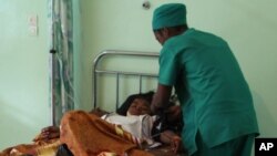 FILE - A person is treated, at a public hospital in Antananarivo, Madagascar. 