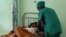 FILE - A person is treated, at a public hospital in Antananarivo, Madagascar. 