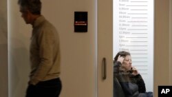 FILE - Members of the The Riveter, a women-focused shared workspace facility, are seen work in Seattle, Washington, Jan. 11, 2019.