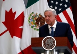 FILE - Mexico's President Andres Manuel Lopez Obrador speaks during an event to sign an update to the North American Free Trade Agreement, at the national palace in Mexico City, Dec. 10. 2019.