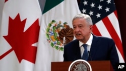 Mexico's President Andres Manuel Lopez Obrador waits to deliver a speech during his visit to a public hospital in Cuernavaca, Mexico, June 19, 2020. 