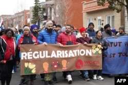 Protestors call on the Canadian government to regularize undocumented migrants in Montreal, Quebec, on March 16, 2024.