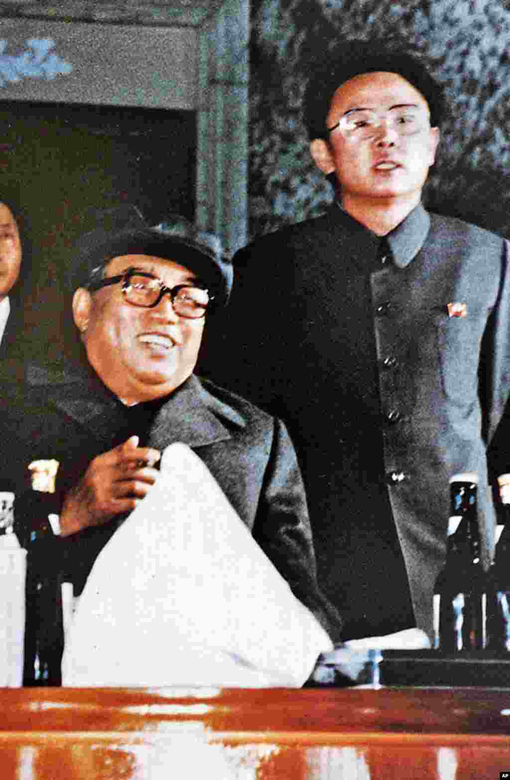 North Korea's Kim Jong-Il (R) and his father Kim Il-Sung (L), who died in July 1994, attending an evening party to celebrate the 6th Korean Worker's Party convention, October, 1980. (AFP)