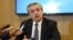 FILE - Handout photo released by Argentinian presidential candidate for the "Frente de Todos" party Alberto Fernandez's press office of him speaking to the press in Buenos Aires, Aug. 14, 2019. 