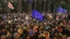 Supporters of Georgia's opposition attend a rally to protest after the government halted the European Union application process until 2028, in Tbilisi, Georgia, on Nov. 28, 2024.