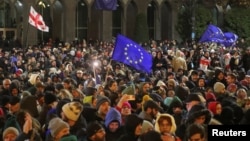 Supporters of Georgia's opposition attend a rally to protest after the government halted the European Union application process until 2028, in Tbilisi, Georgia, on Nov. 28, 2024.